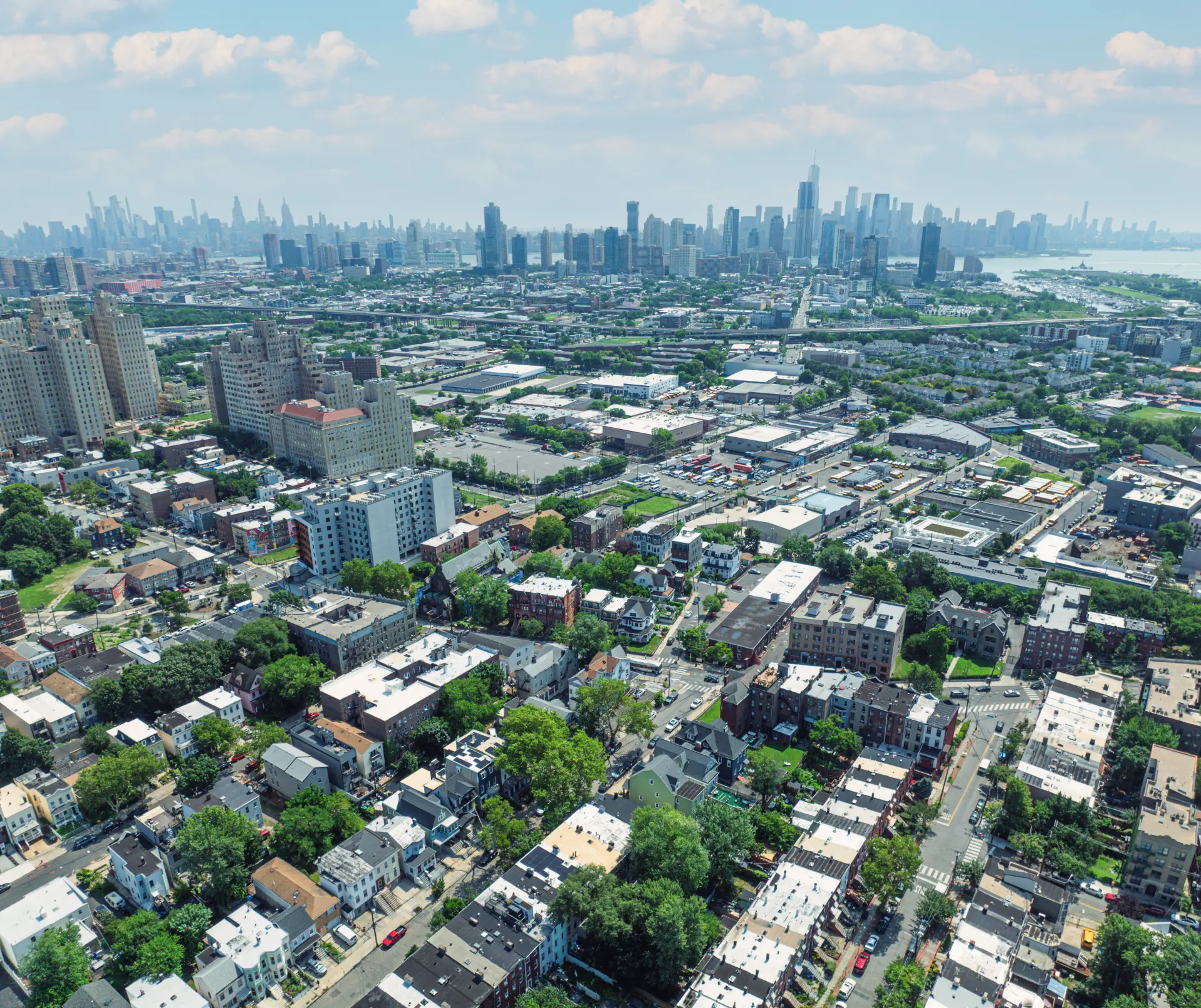 Aerial view of the Jersey City HAP Portfolio neighborhood with the Manhattan skyline beyond