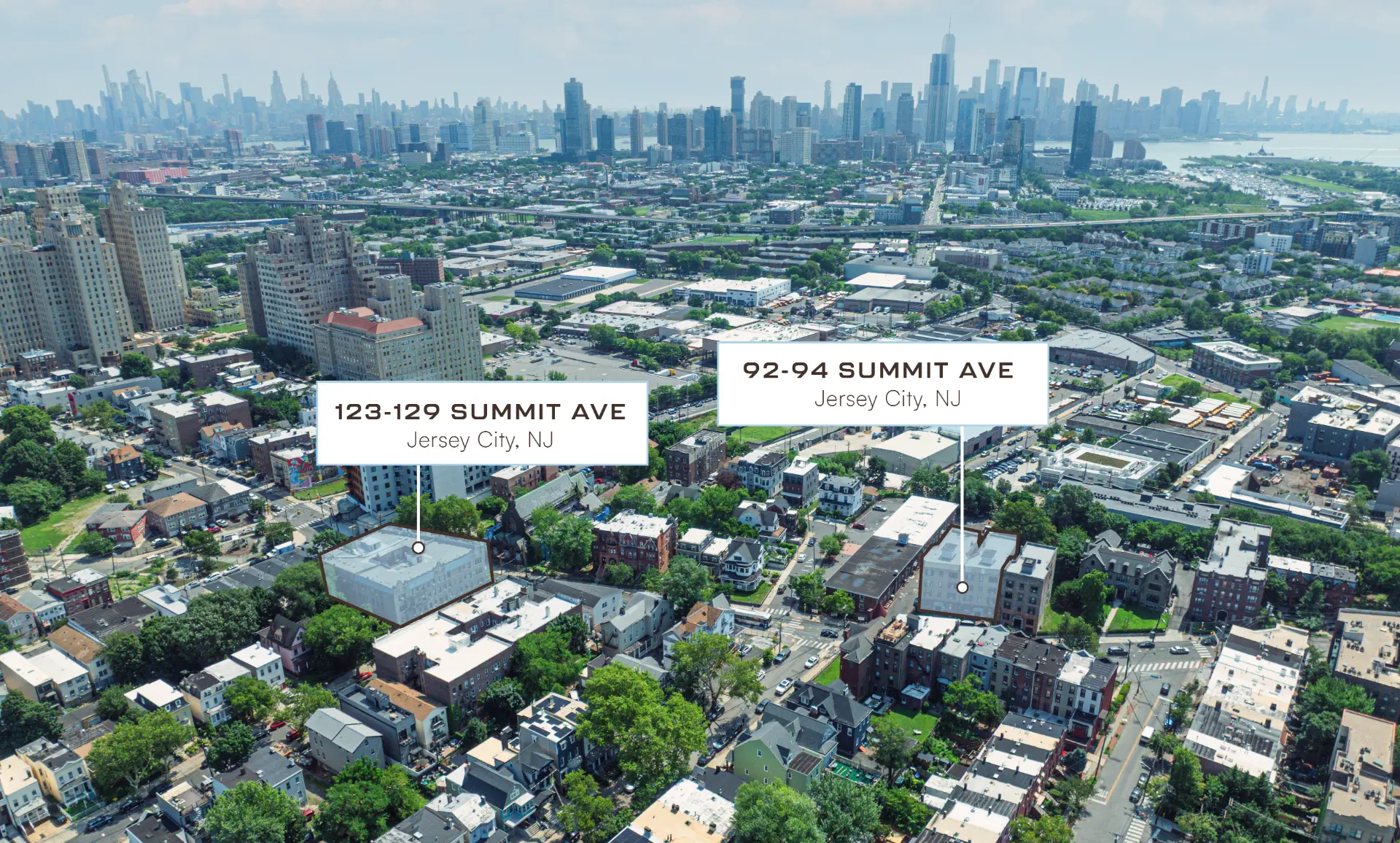 Aerial view of 92–94 Summit Ave and 123–129 Summit Ave with the Manhattan skyline beyond