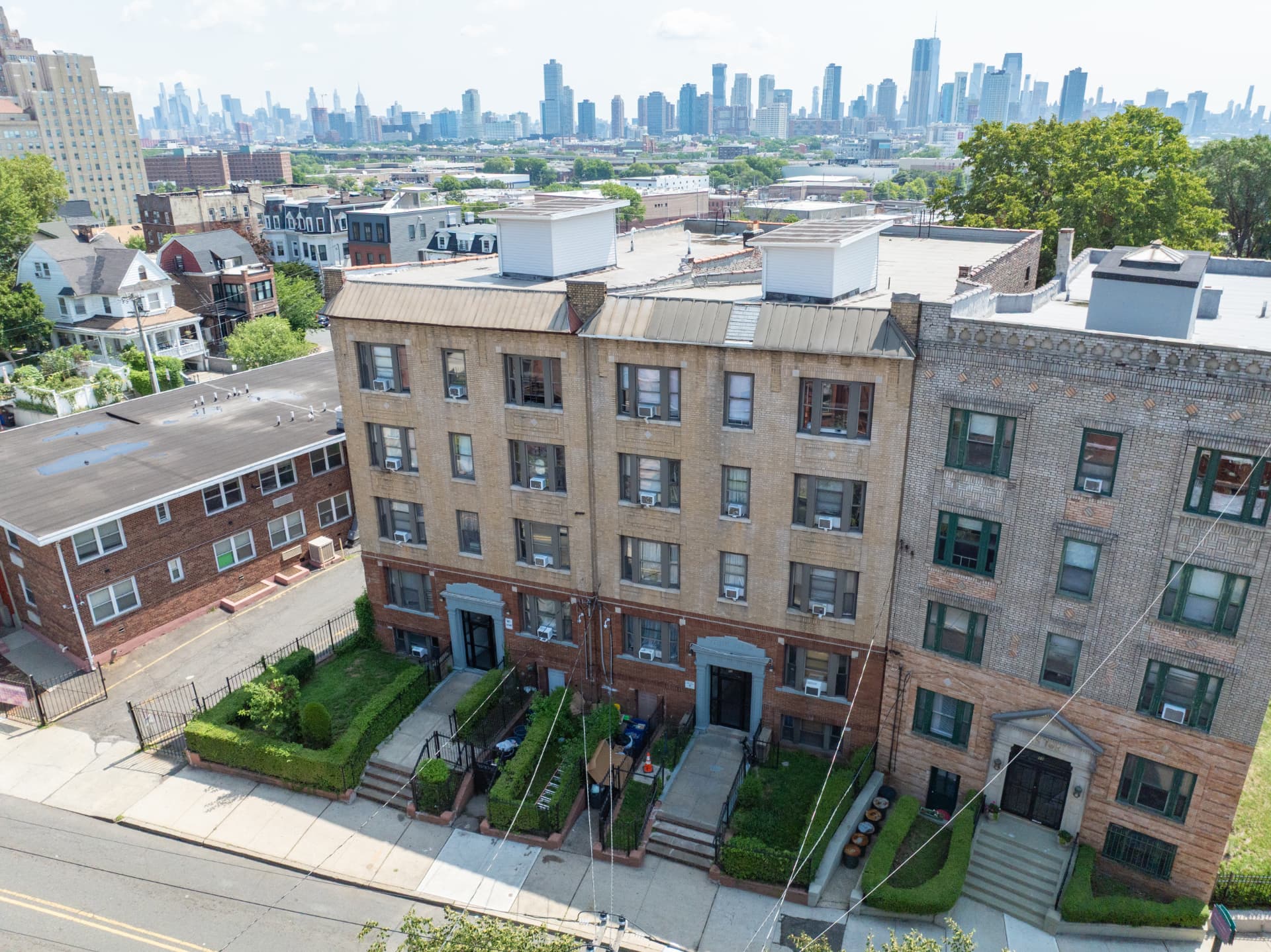 Aerial view of 92–94 Summit Ave, Jersey City, with the Manhattan skyline beyond